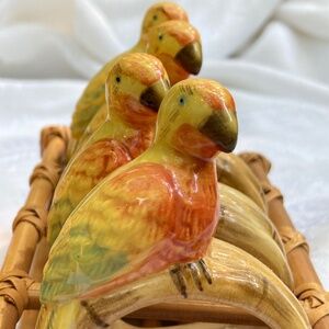 Vintage ceramic parrot napkin rings in bamboo holder